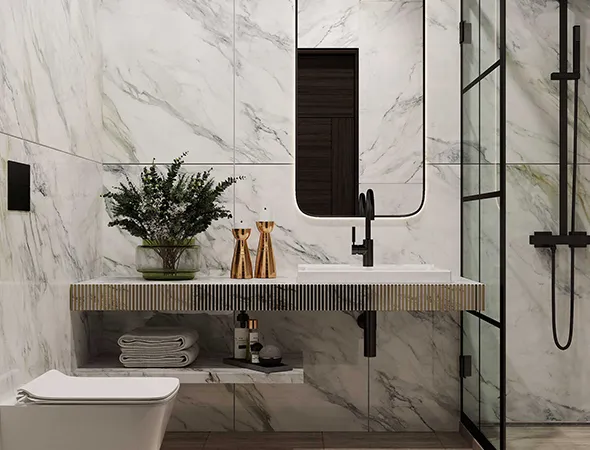 A renovated bathroom featuring elegant marble walls and flooring, showcasing a luxurious and modern design aesthetic.