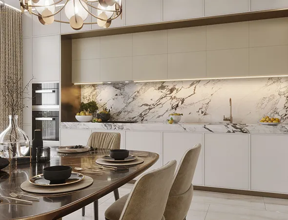 A modern kitchen featuring elegant marble countertops and a stylish dining table, showcasing a recent renovation.