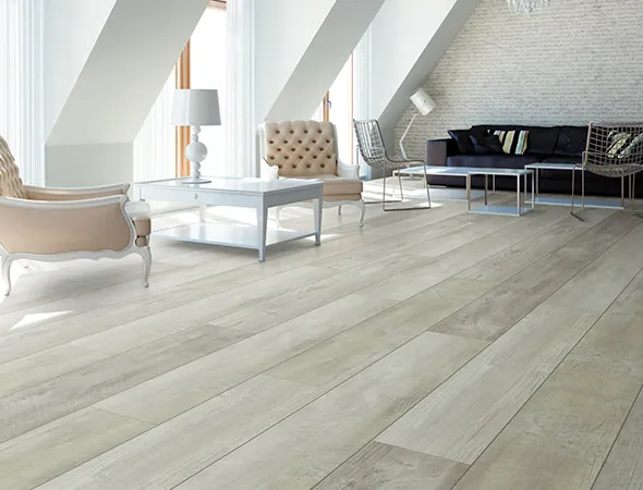 A renovated living room featuring white walls and polished wood floors, creating a bright and inviting atmosphere.