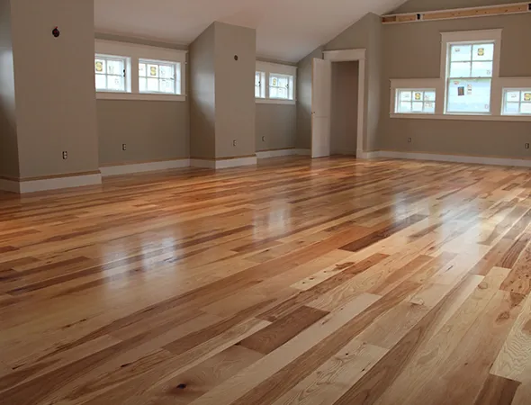 A beautifully renovated living room displays a wooden floor, enhancing the space's charm.